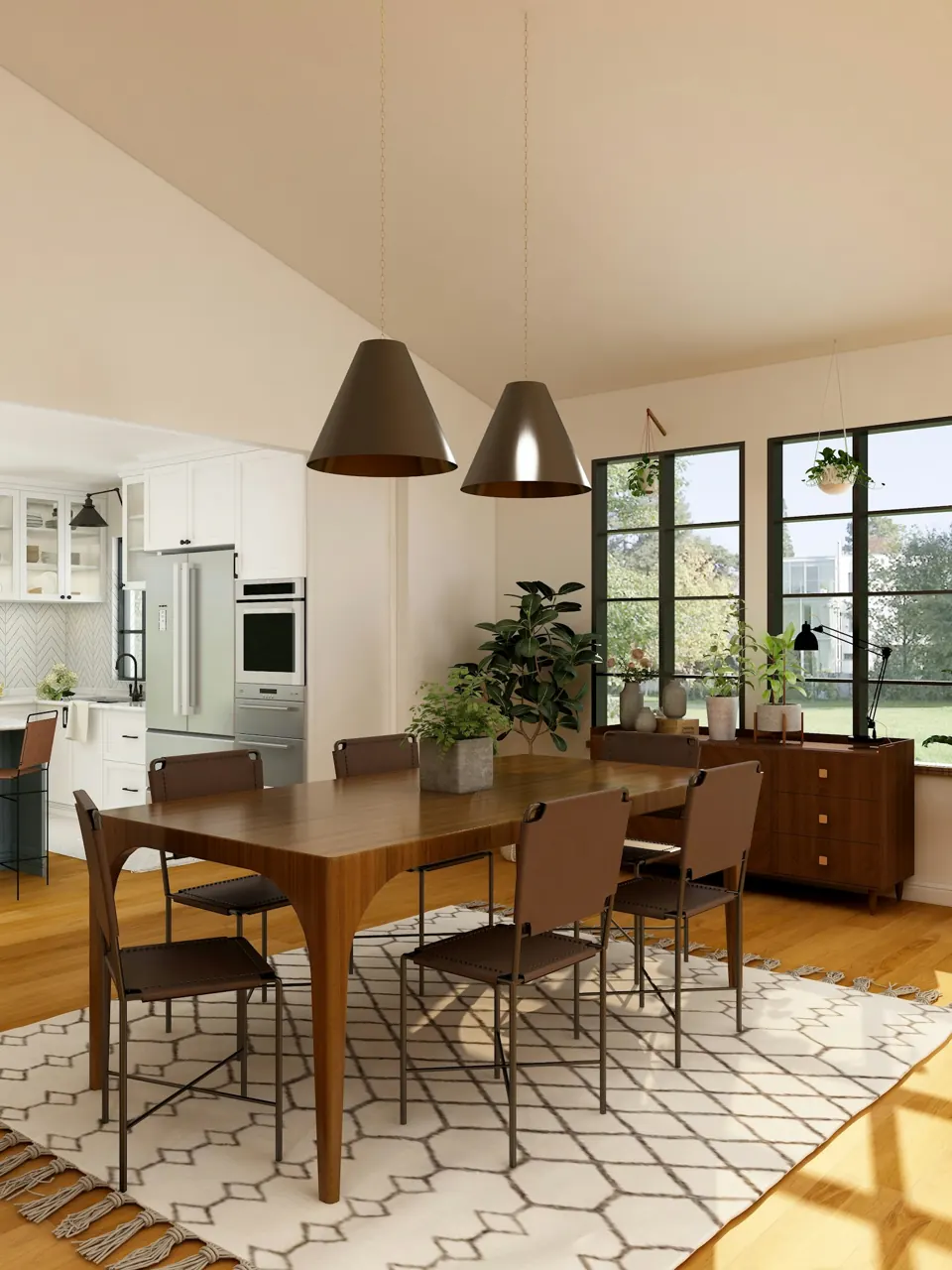 Timber dining table with leather chairs and large pendant shades in an open kitchen